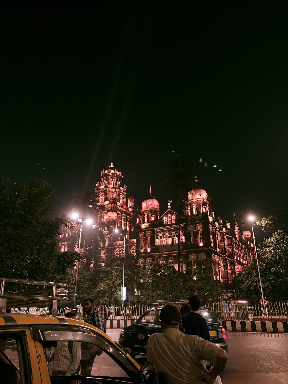 An ornate building lit at night