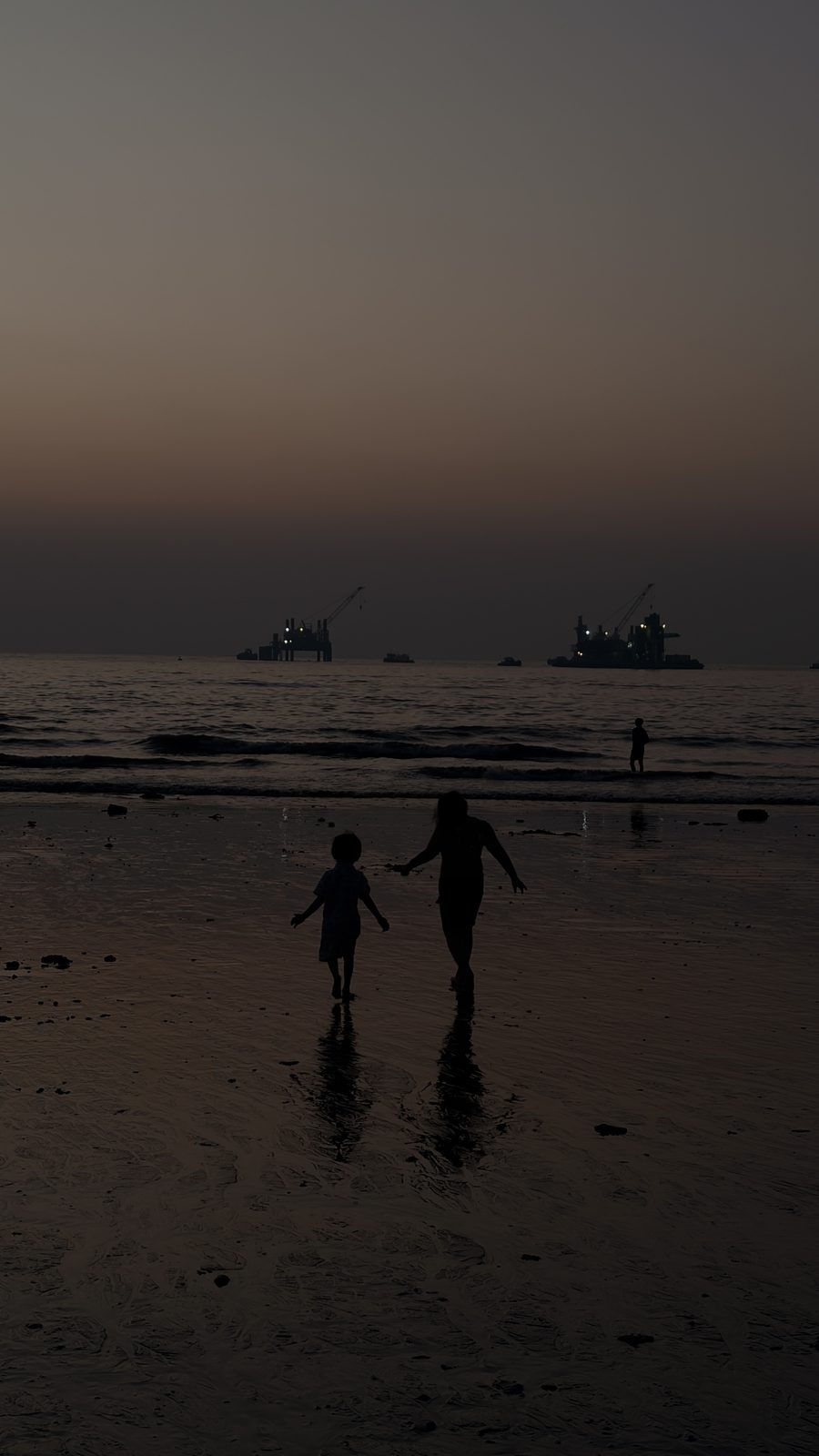 Silhouettes on a beach at dusk